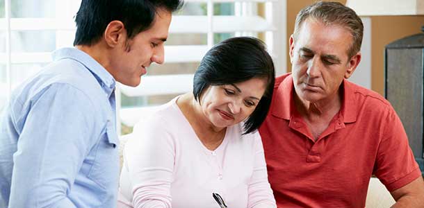 Financial Advisor Talking To Senior Couple.