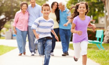 A family walking on the sidewalk