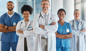 stock image of medical professionals all standing together and smiling