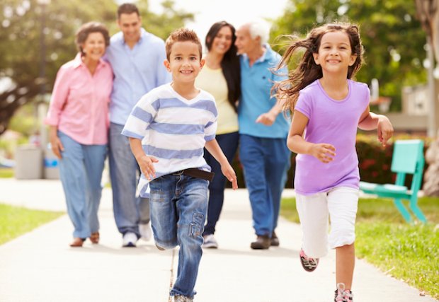 A family walking on the sidewalk