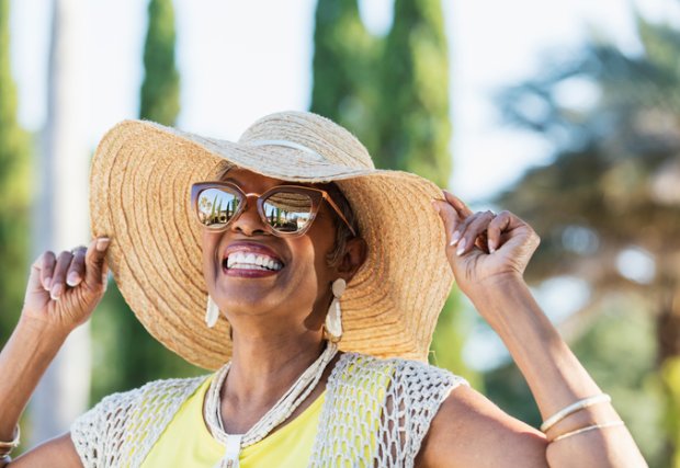 woman wearing hat and sunglasses