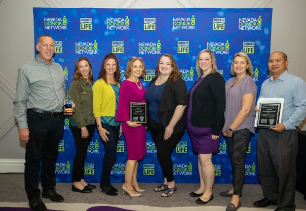 Nevada Donor Network Honorees standing in front of a blue banner