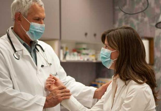 doctor in mask with patient