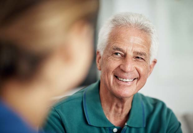 Senior man talking to doctor