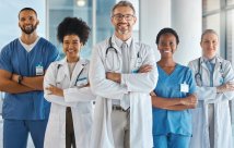 stock image of medical professionals all standing together and smiling