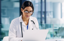 Female doctor working on her computer