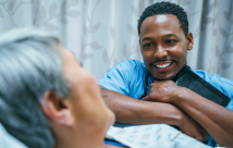 Male nurse treating a female patient