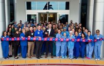 People cutting a ribbon to open West Henderson Hospital