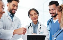 A group of medical residents discussing a chart