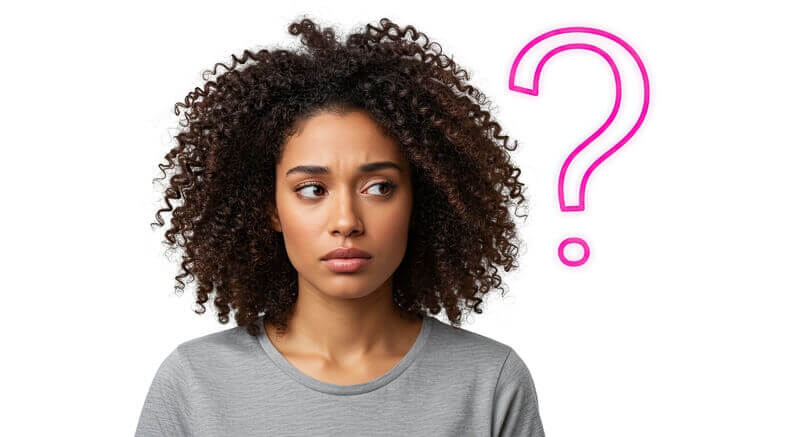 Close-up of woman looking confused with large question mark near face.